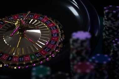 Live Caribbean Stud Poker table with dealer and cards visible
